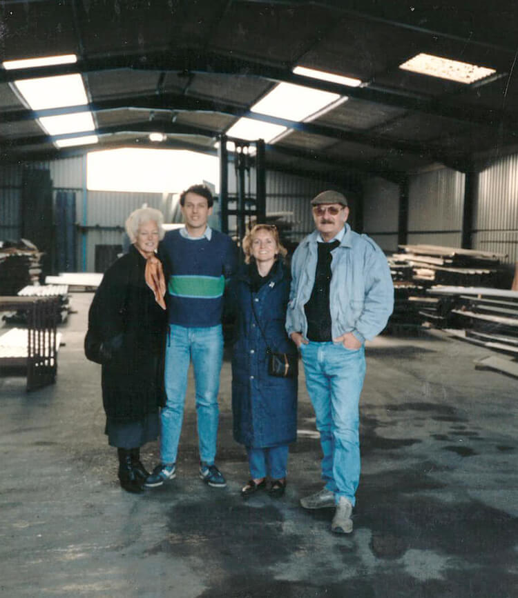 The Trescher family and a friend stood inside warehouse in 1989
