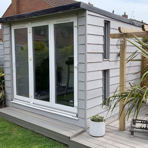 Light Grey Fibre Cement Cladding is the perfect way to finish any small garden room design, complementing the surrounding Decking. Fibre Cement Boards used as cladding on a domestic garden room