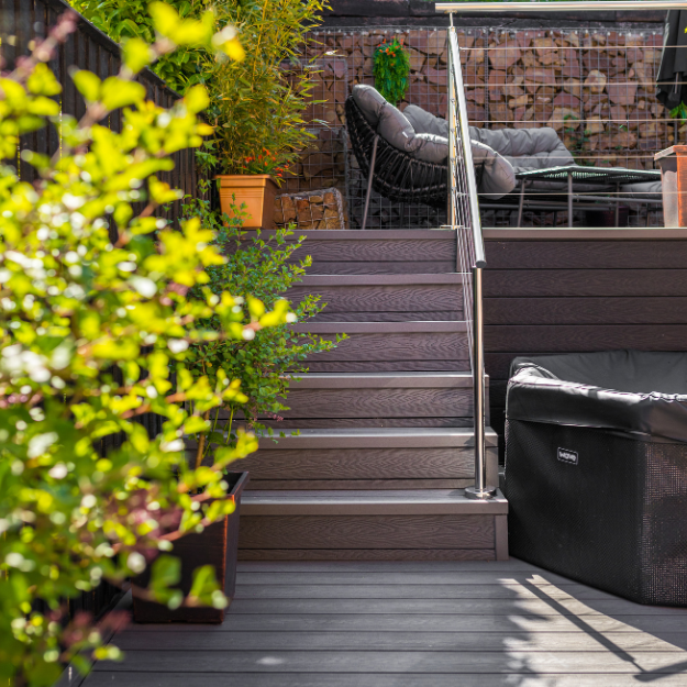Cladco Composite Decking Boards in Stone Grey Woodgrain with matching Corner Trims for a seamless set of steps