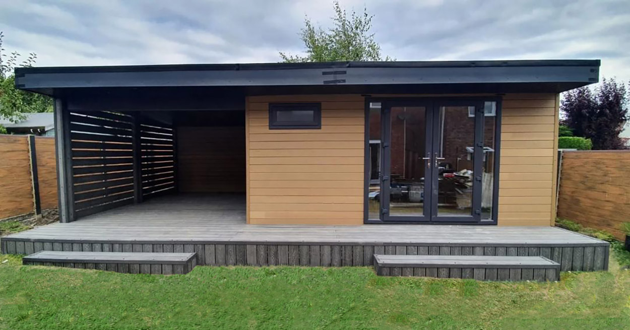 A double-door garden room with Teak Wall Cladding Boards installed horizontally to create the illusion of additional width.