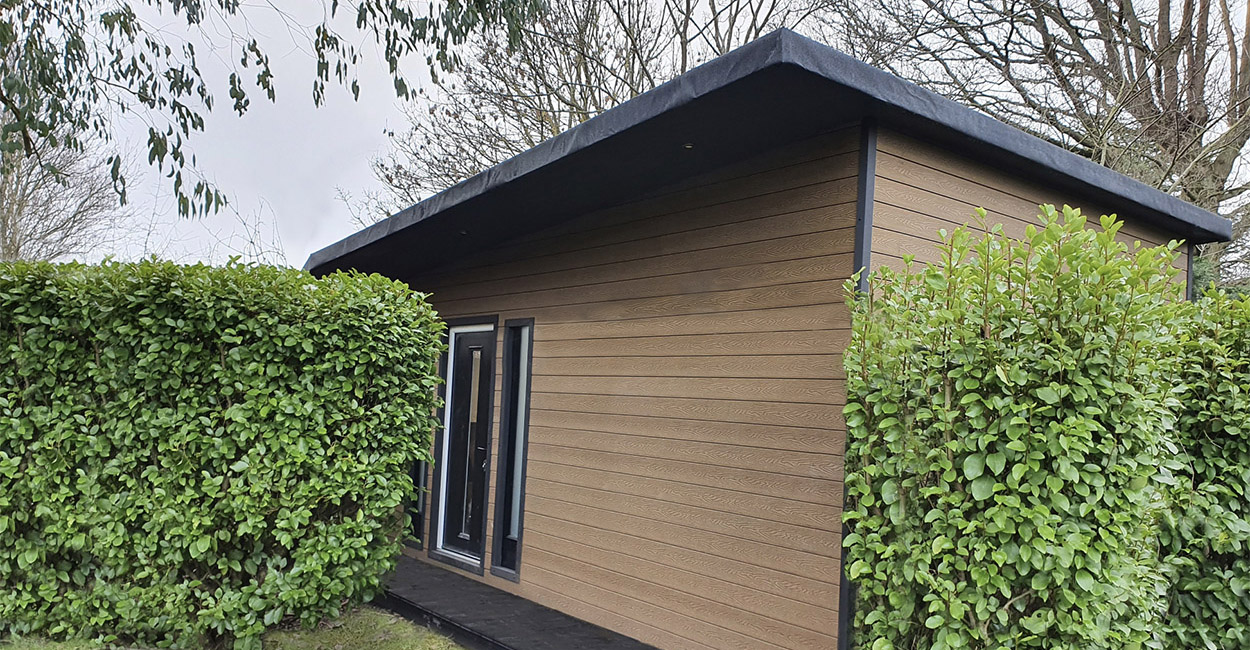 A garden room with Composite Wall Cladding installed