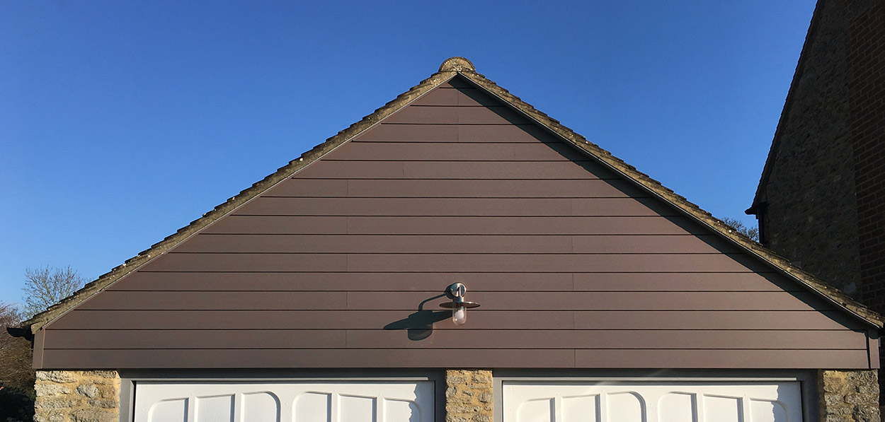 Coffee-coloured Wall Cladding has a natural tone that mimics the look of treated timber on this garage facia.