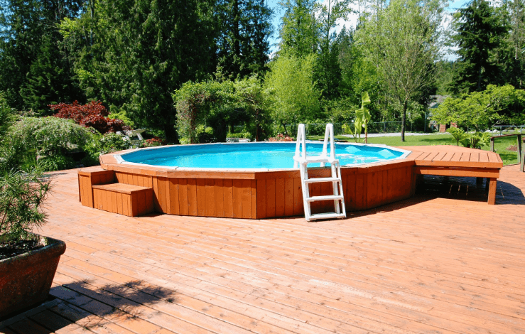 Swimming pool set within a raised deck