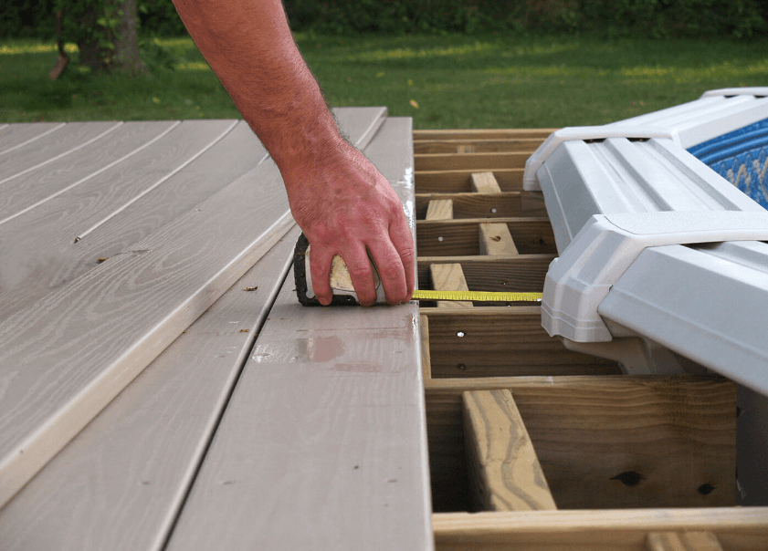 Man measuring decking