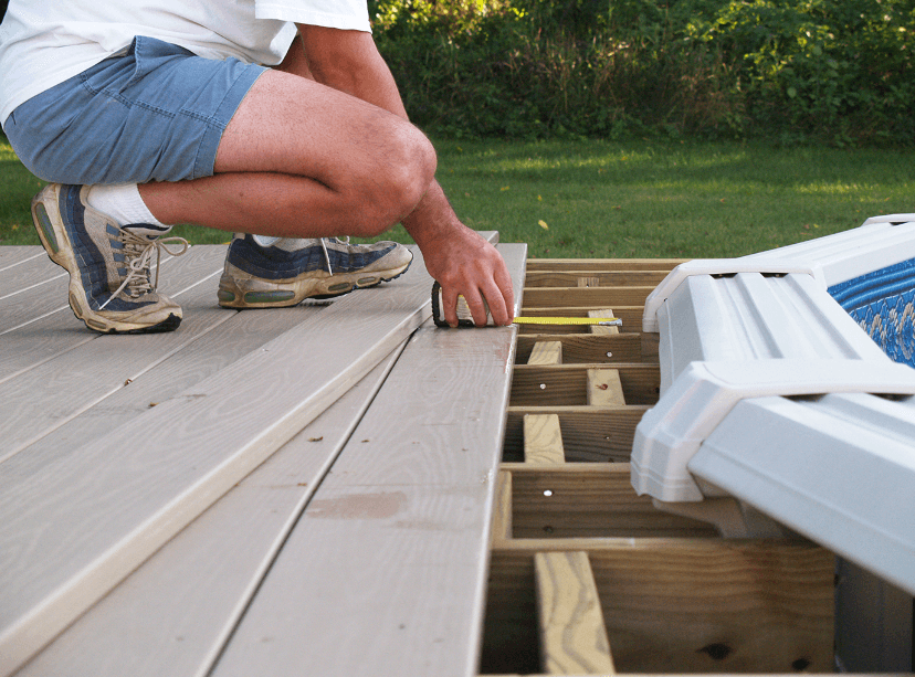 Man measuring a deck