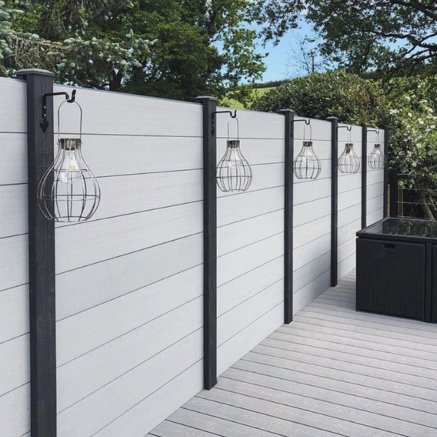 Light Grey Composite Fencing with Charcoal Posts and lanterns
