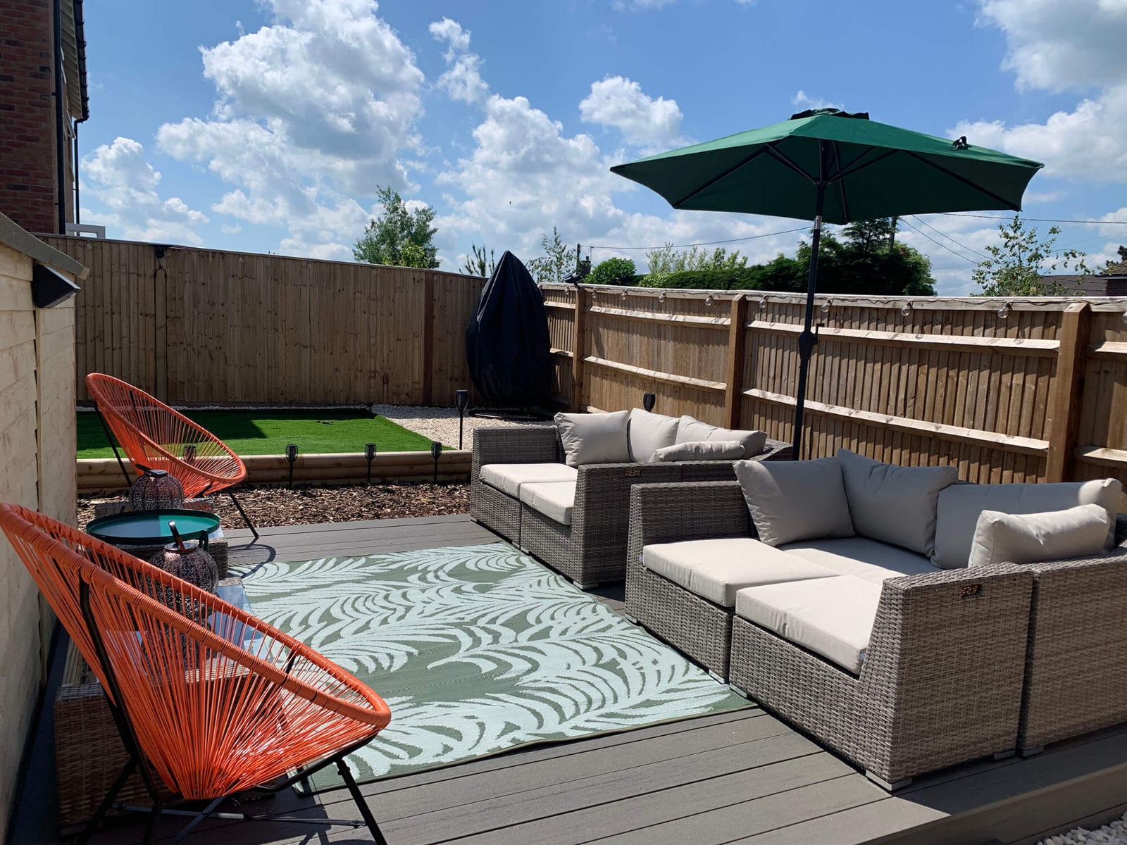 Ash Grey Cladco Premium PVC Decking Boards installed in a new build garden.