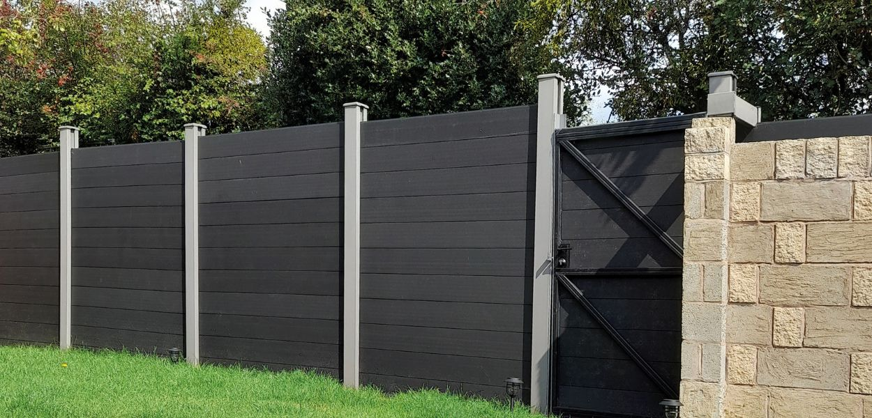 Customer image of Composite Fencing in Charcoal, with Stone Grey posts.