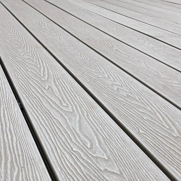 Woodgrain effect composite decking with t-clips installed