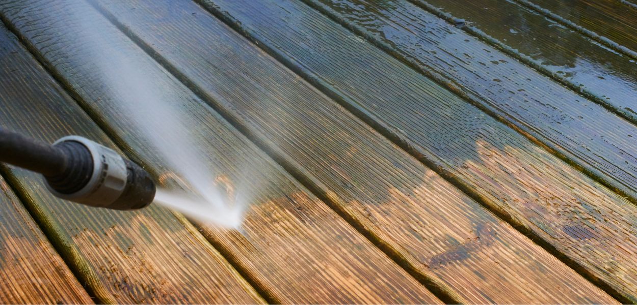 Power washing dirty timber decking