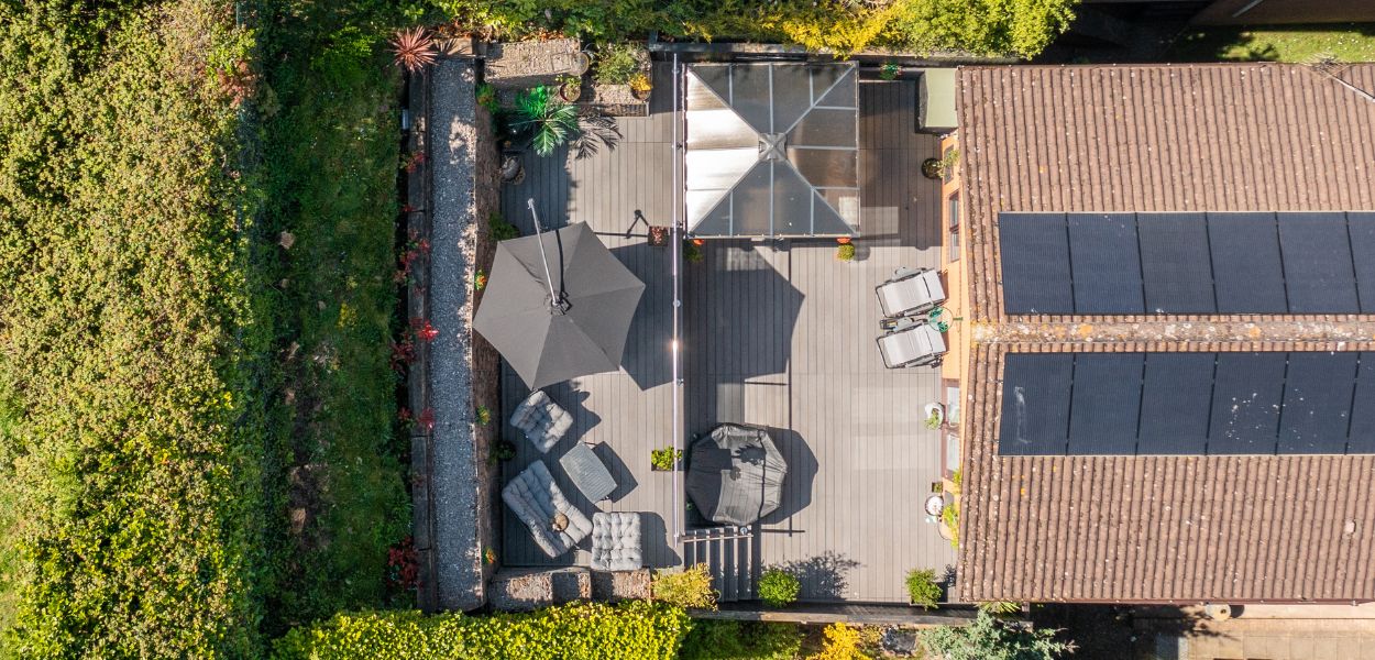 House and patio with Cladco Woodgrain Stone Grey Composite Decking, bird's eye view.