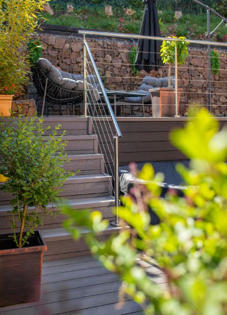 Outdoor area steps with Cladco Woodgrain Stone Grey Composite Decking.