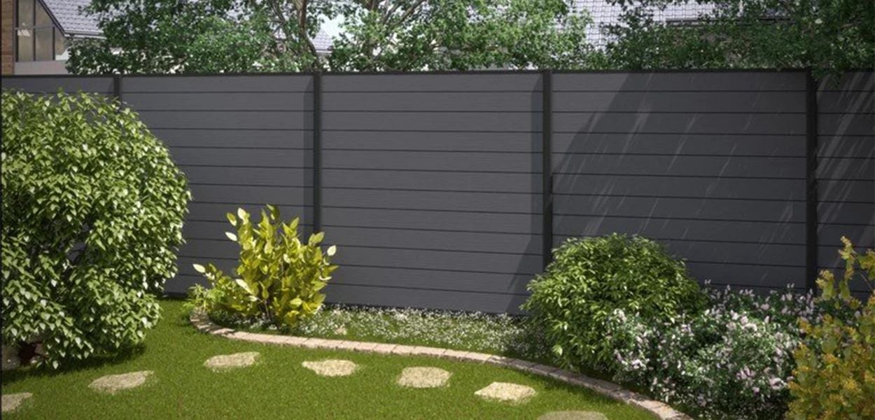 composite fencing in a lush green garden