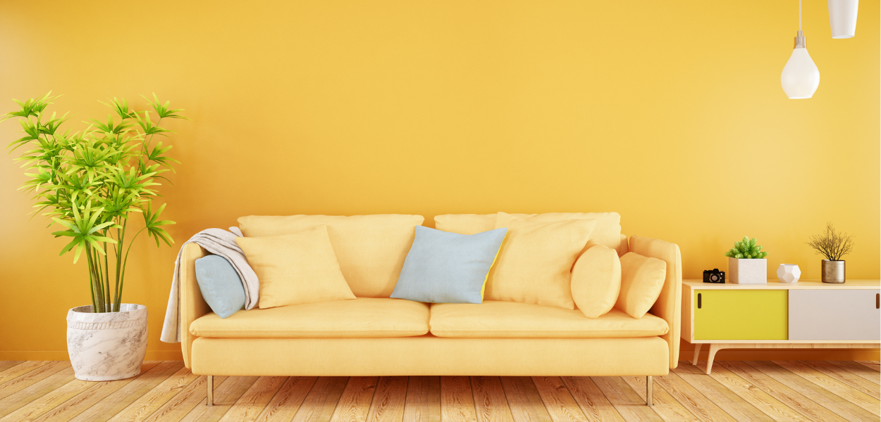 Feature wall colours: bright yellow walls will add light and warmth to an otherwise plain room