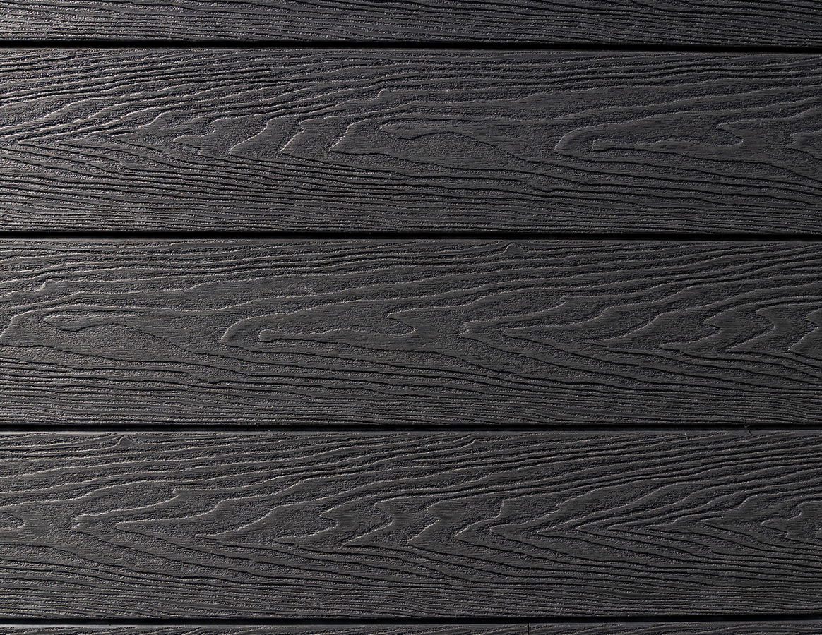 Close up of Cladco Signature woodgrain composite wall cladding in charcoal.