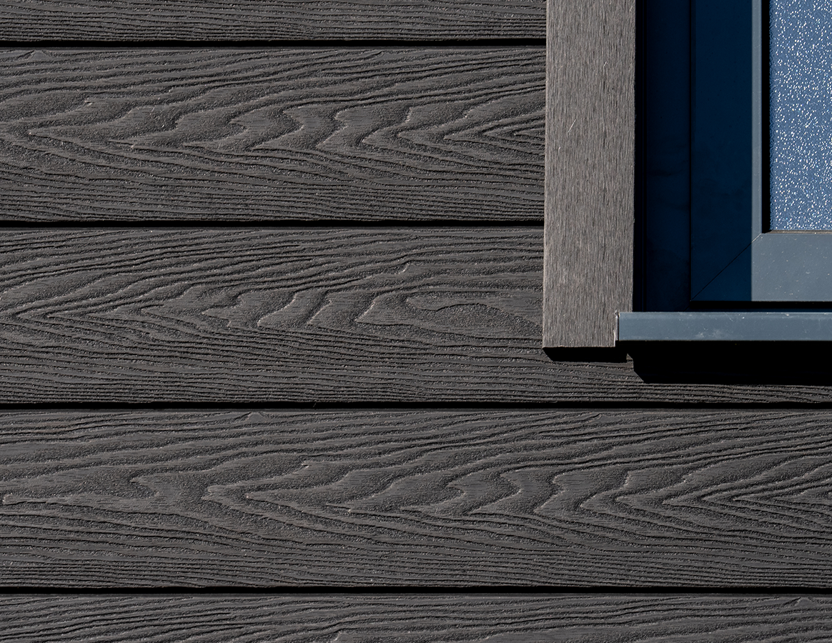 Close up view of the intricate woodgrain details of Cladco composite wall cladding.