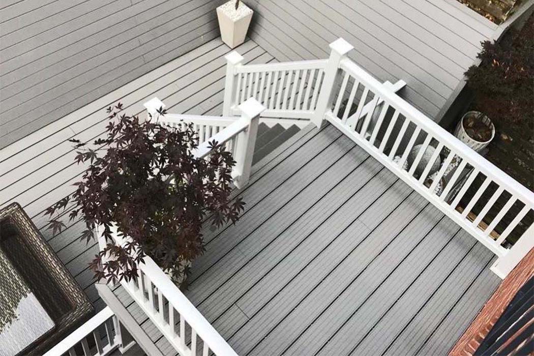 Multi-level small garden with grey decking