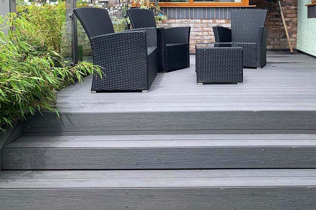 Grey PVC Decking and steps installed in a small patio area