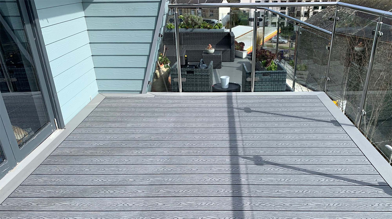 Small balcony with grey woodgrain decking