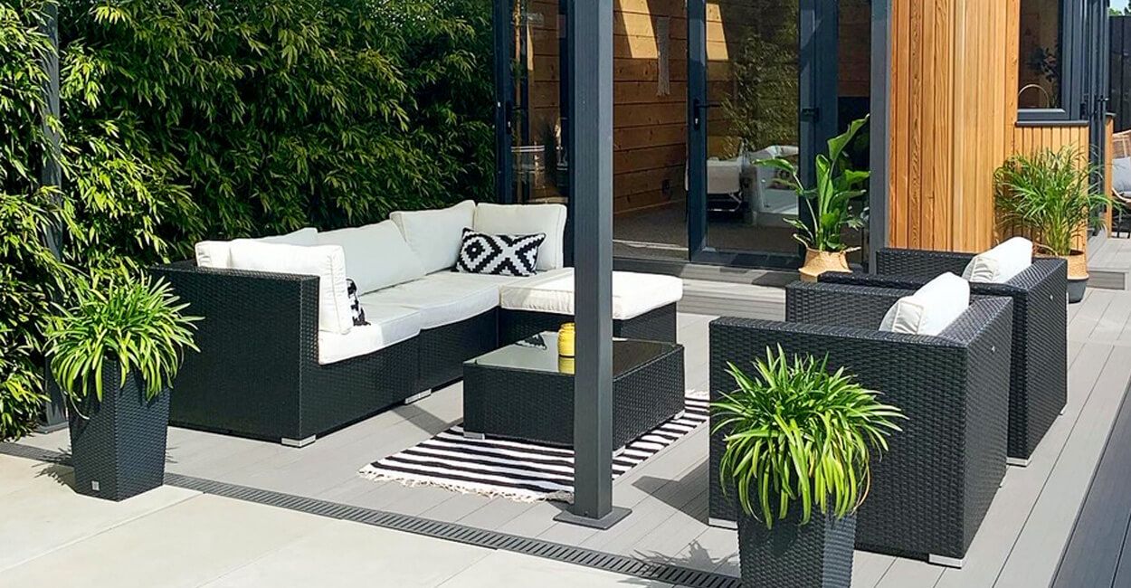 Light Grey Decking Boards with a built in pergola and large seating area