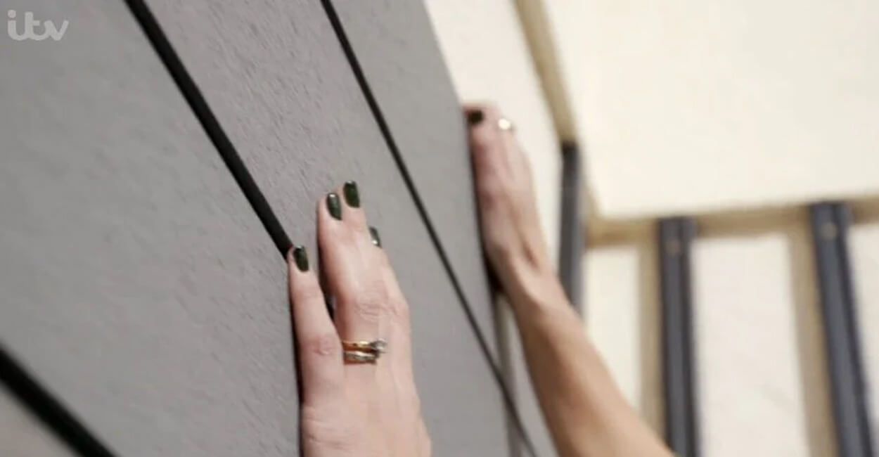 Close up on Womans hands installing cladding